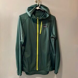 Patagonia women’s Houdini jacket, size Large, color muted green w/yellow zippers